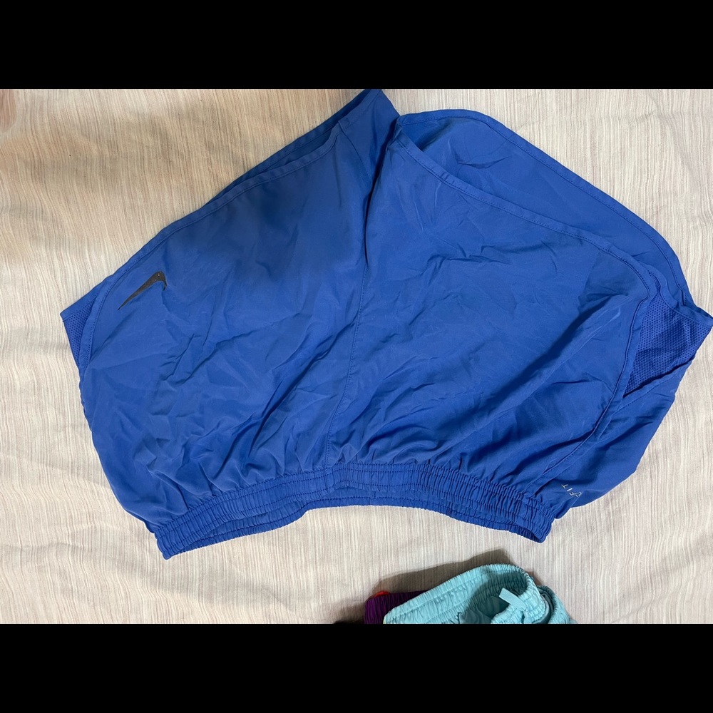 Blue Nike running shorts